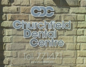 a sign outside the building reading 'Churchfield Dental Centre'