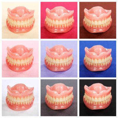 dentures displayed on multiple different background colours