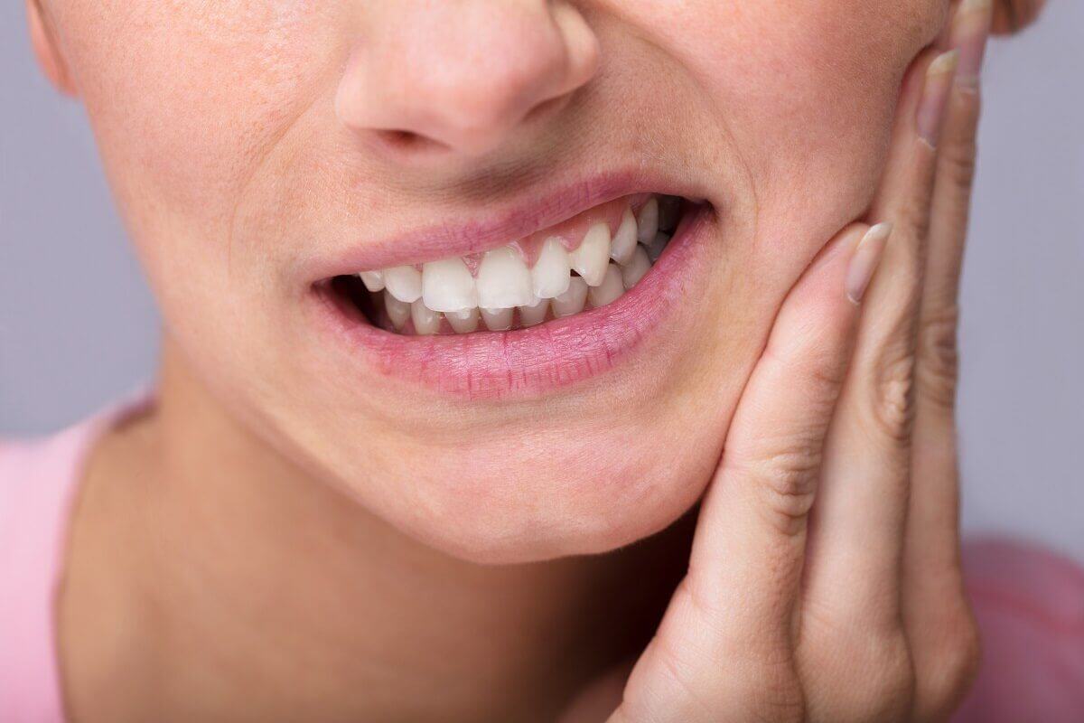 woman suffering from sensitive teeth